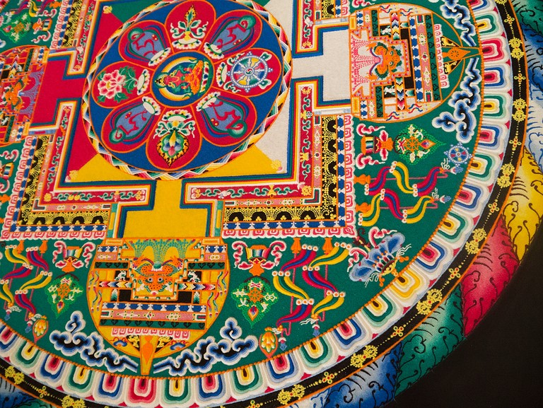 detail of a colored sand mandala